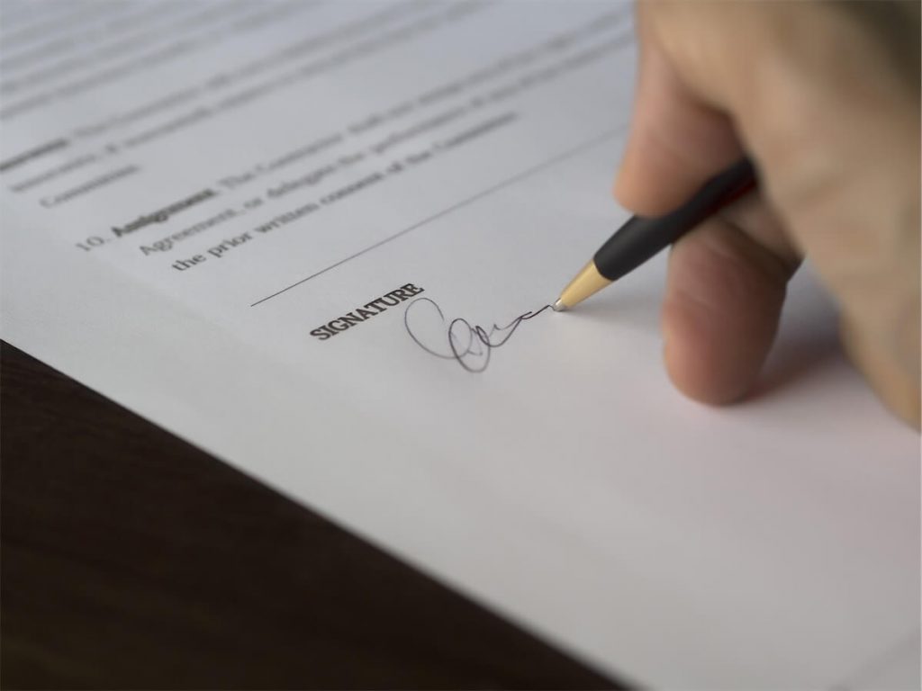 Man signing his BUC documents