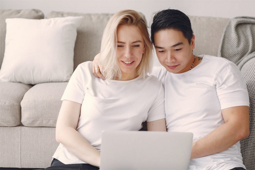 Couple weighing their options between hdb home loan and a bank loan