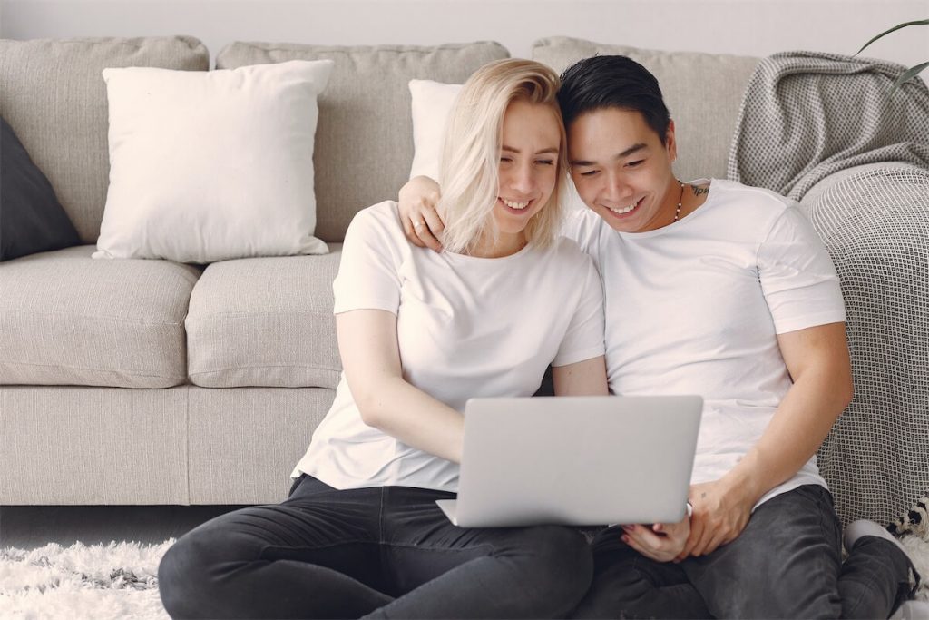 Couple calculating their TDSR to see if they are eligible for a home loan in Singapore